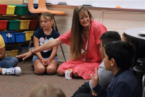 Seedling Mile teacher engaging students sitting in a circle